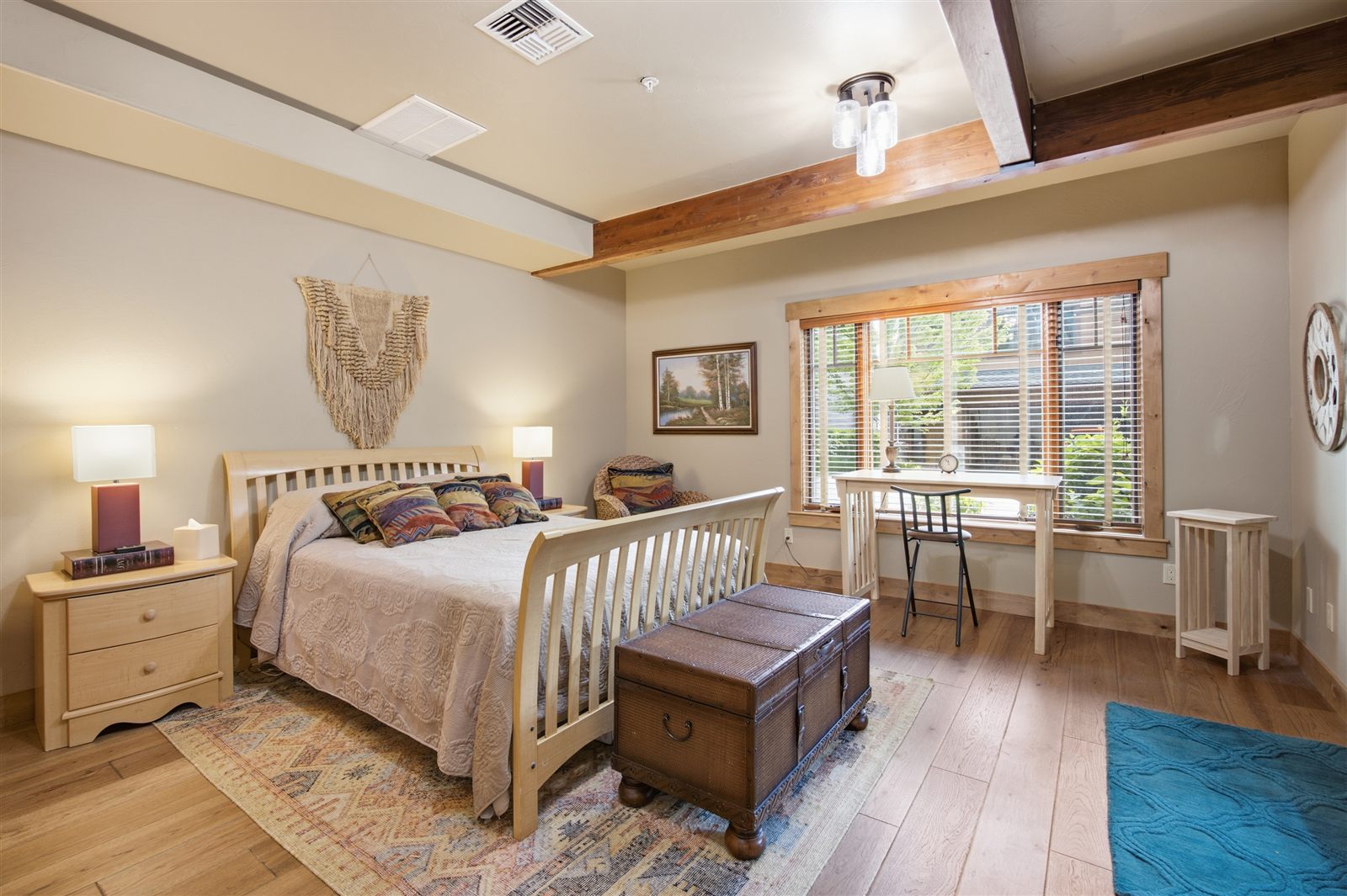 Cozy bedroom with warm wood tones photographed for a Missoula listing