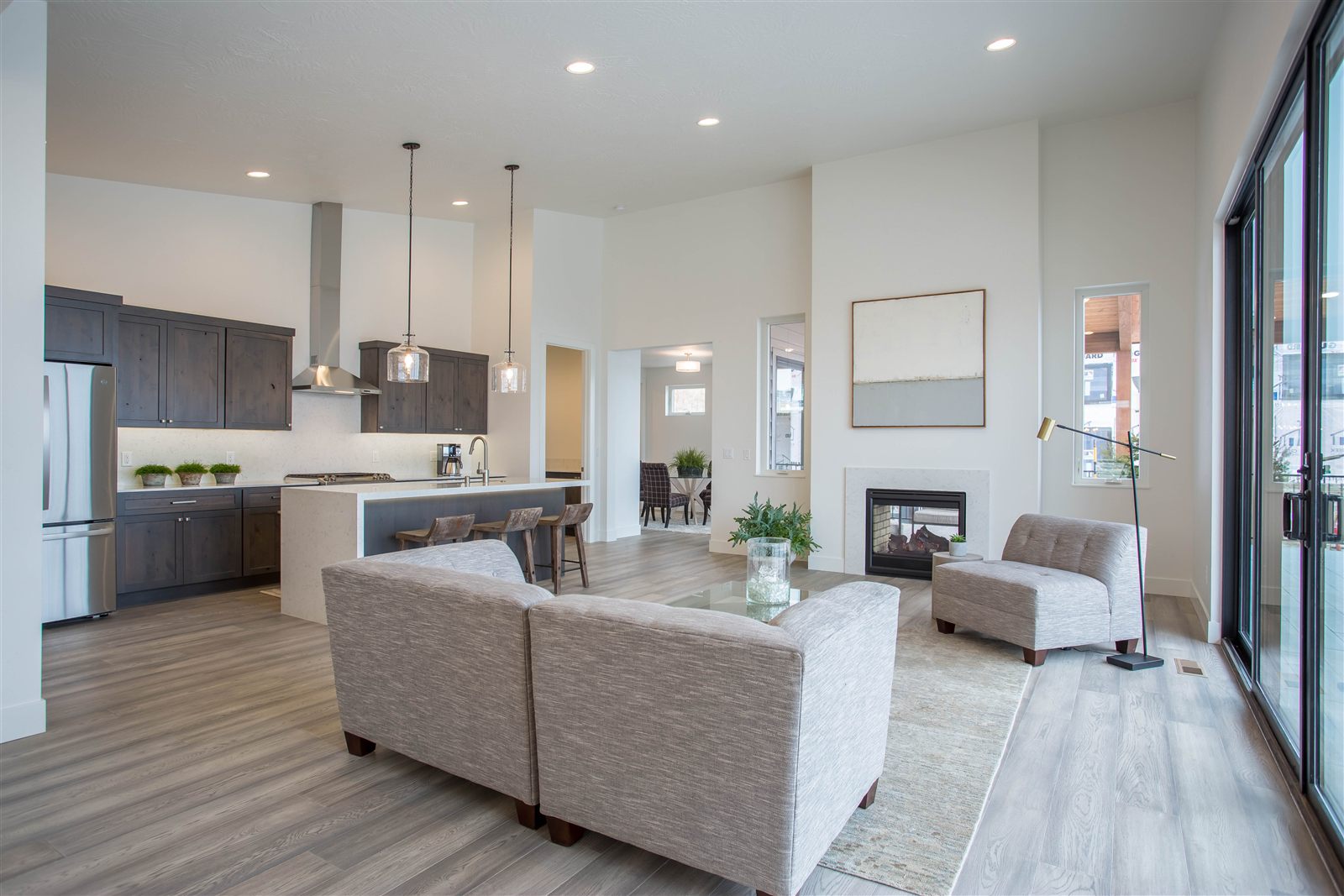 Open-concept living room and kitchen photographed for a Missoula listing by PMZ Photography