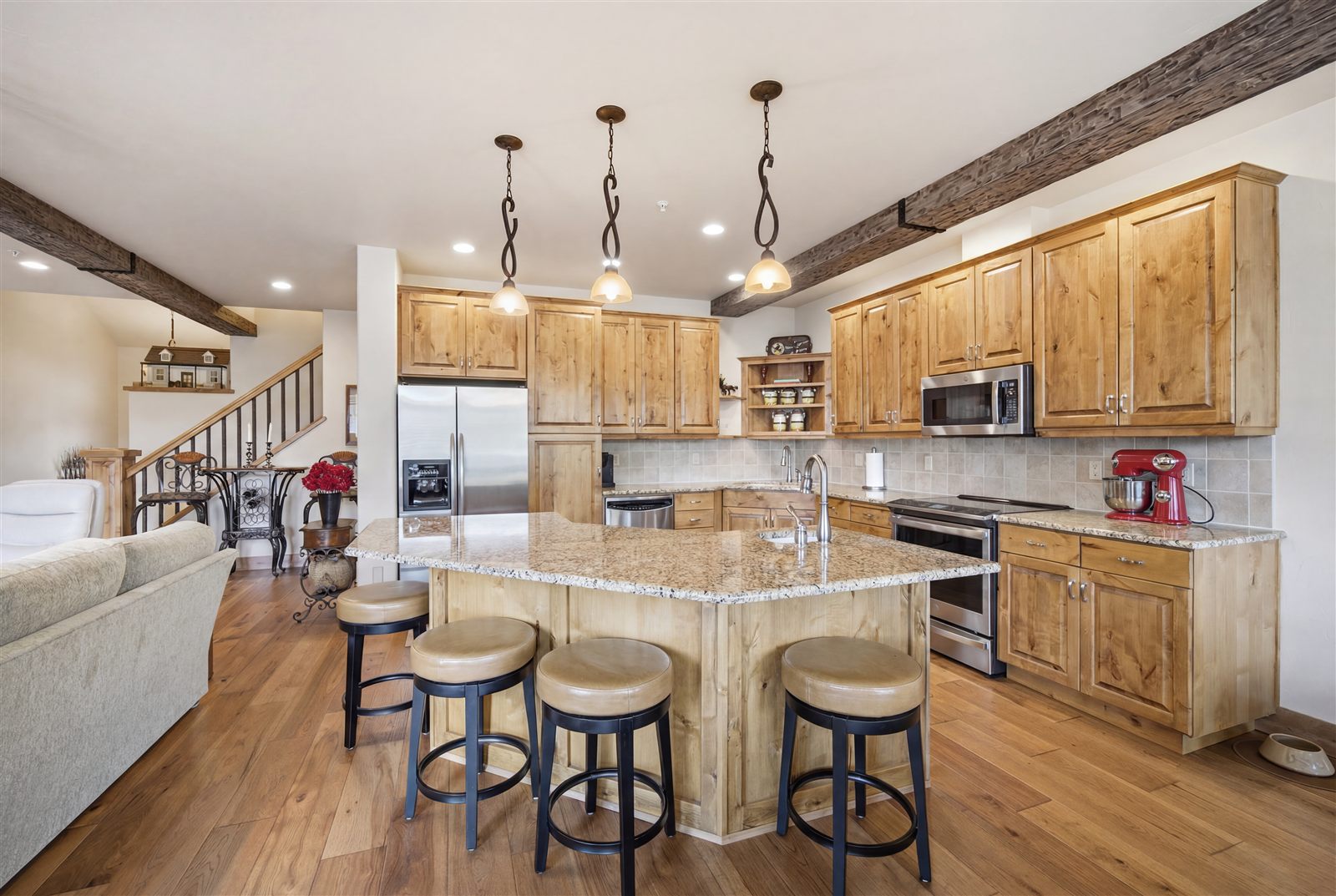 Rustic wood kitchen with granite island in a Montana home